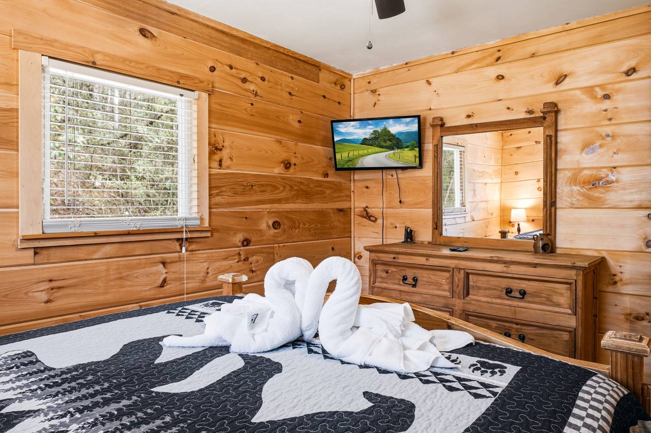Comfortable queen bed for restful nights with flat screen TV Comfortable queen bed for restful nights with flat screen TV
