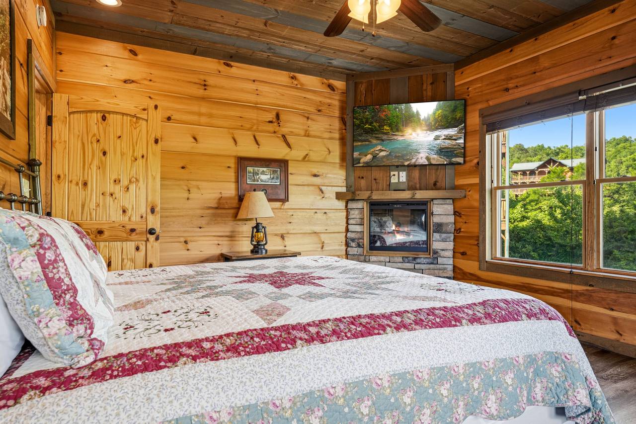 Entry King Suite: Deck Access, Fireplace, TV, & Mountain Views Entry King Suite: Deck Access, Fireplace, TV, & Mountain Views