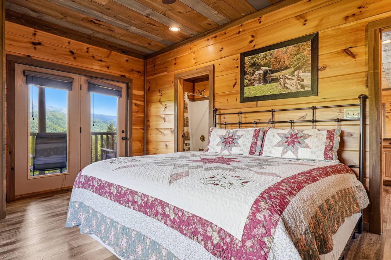 Entry King Suite: Deck Access, Fireplace, TV, & Mountain Views Entry King Suite: Deck Access, Fireplace, TV, & Mountain Views