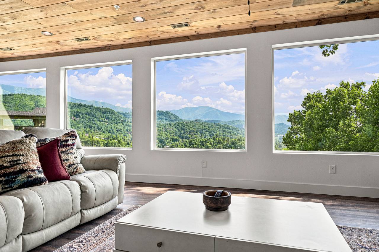 Cozy living room with fireplace, Smart TV & mountain views Cozy living room with fireplace, Smart TV & mountain views