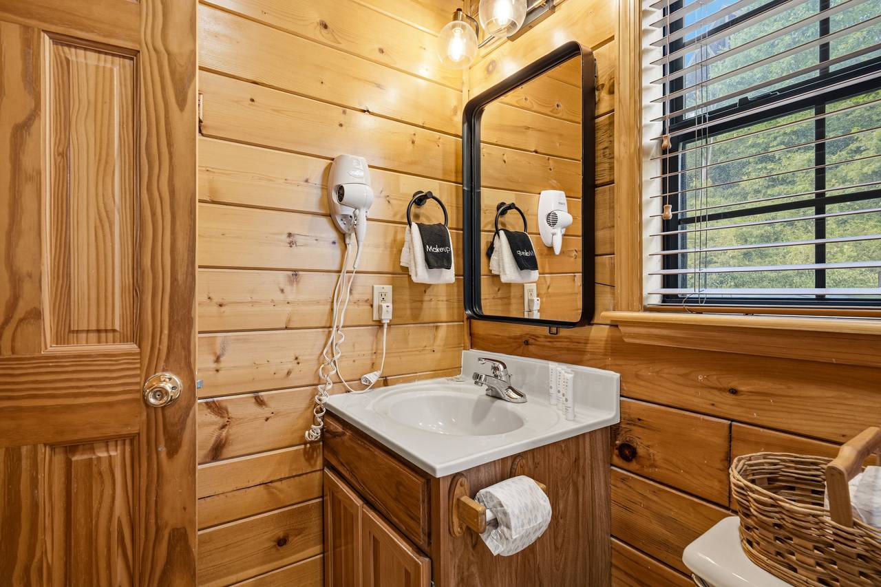 Main level ensuite full bath with tub and shower combo Main level ensuite full bath with tub and shower combo