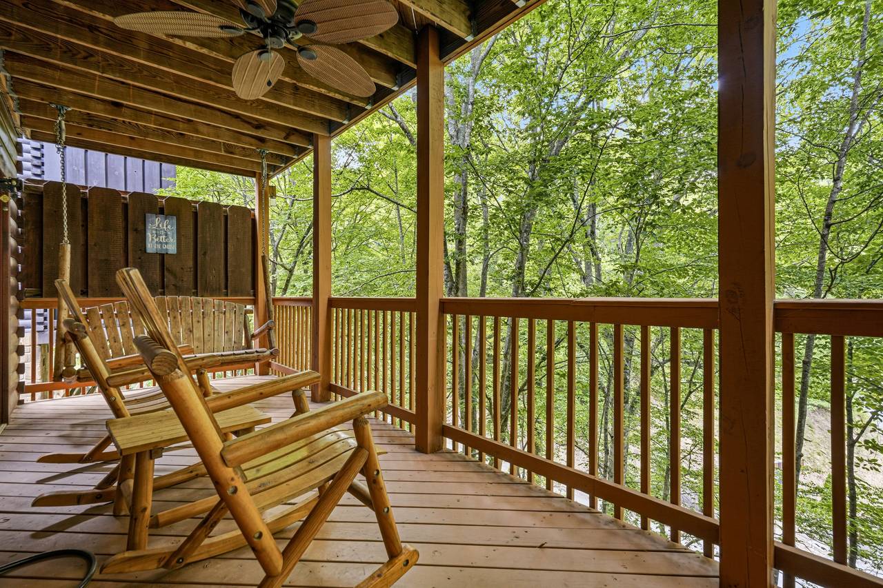 Peaceful Wooded Deck With Outdoor Seating Peaceful Wooded Deck With Outdoor Seating