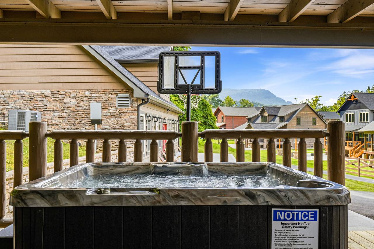 Covered hot tub with relaxing mountain views Covered hot tub with relaxing mountain views