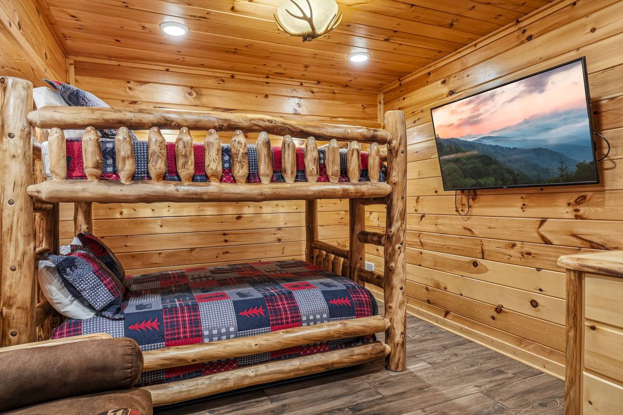 Bunk room with queen-over-queen bunk and futon Bunk room with queen-over-queen bunk and futon