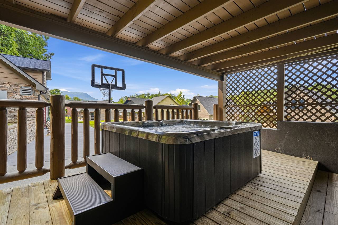 Covered hot tub with relaxing mountain views Covered hot tub with relaxing mountain views