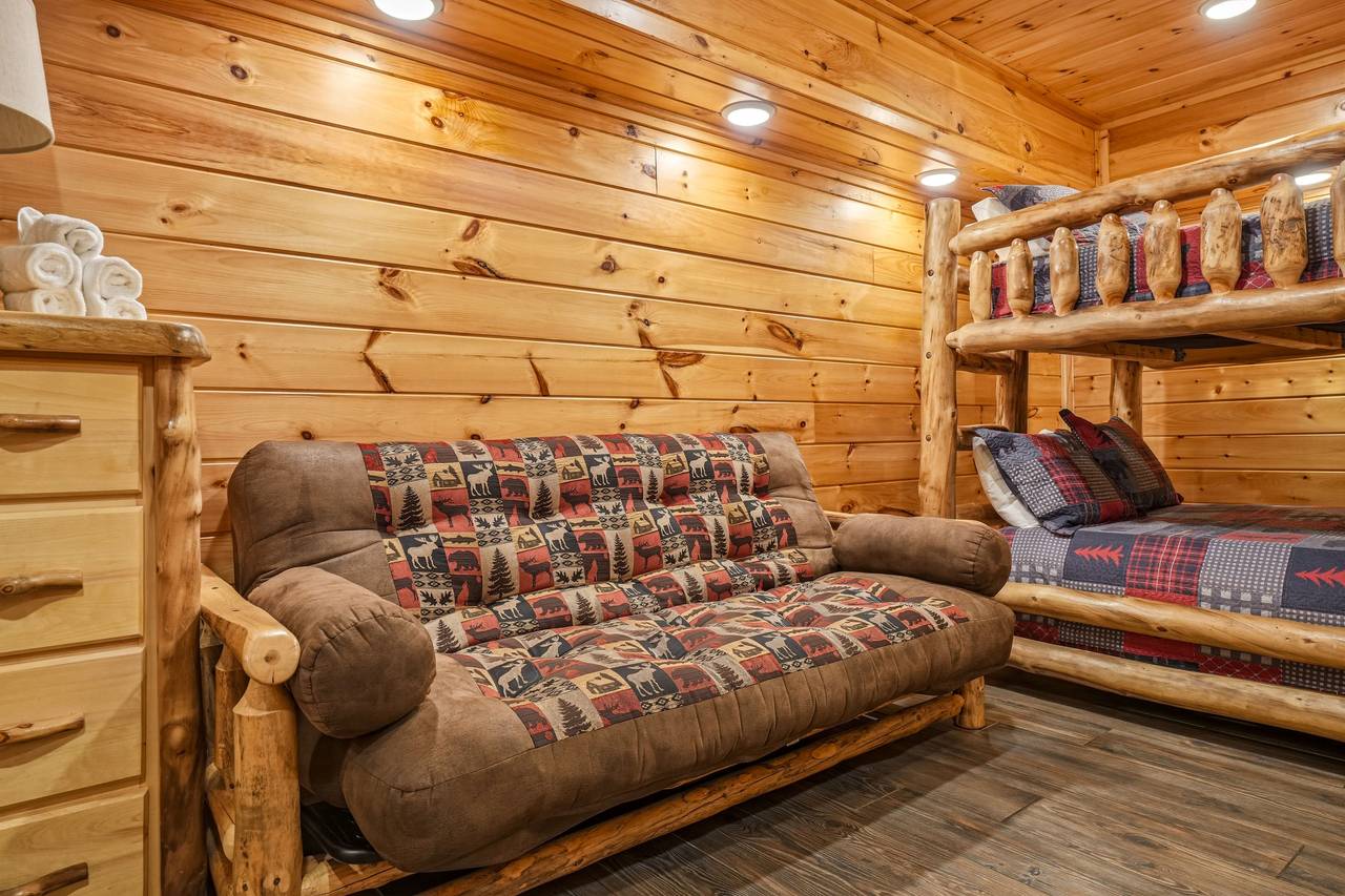 Bunk room with queen-over-queen bunk and futon Bunk room with queen-over-queen bunk and futon