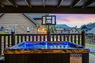 Covered hot tub with relaxing mountain views Covered hot tub with relaxing mountain views