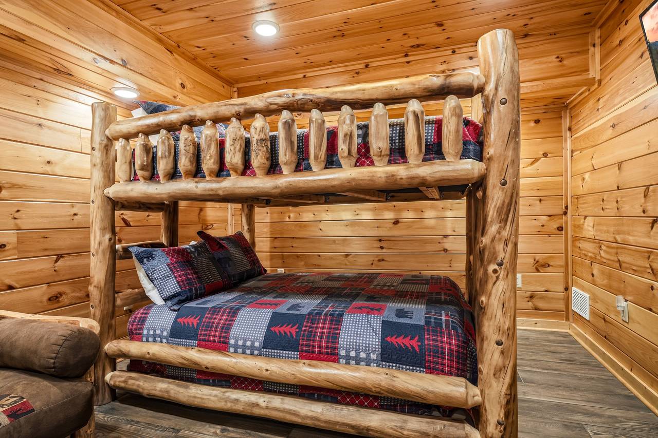 Bunk room with queen-over-queen bunk and futon Bunk room with queen-over-queen bunk and futon