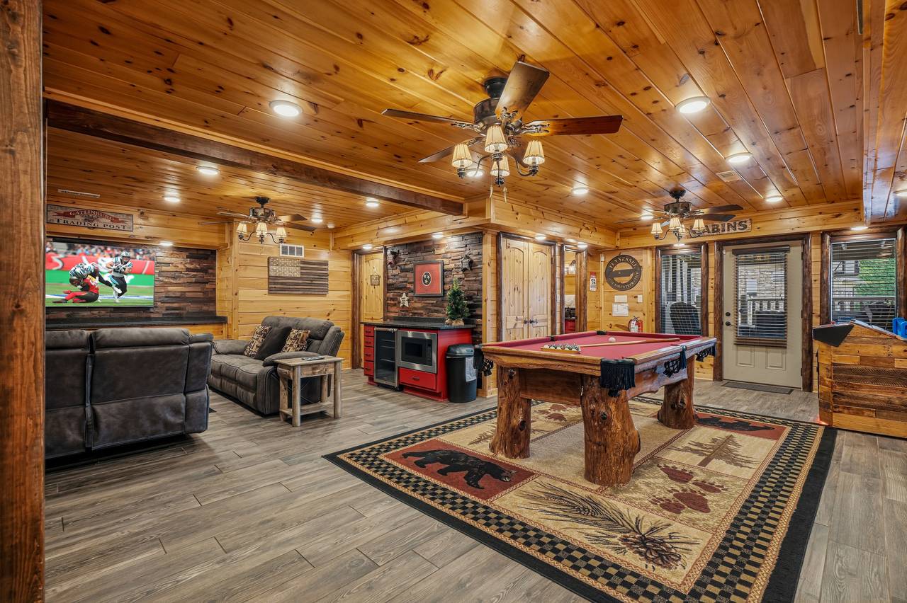 Game room featuring pool table and arcade games Game room featuring pool table and arcade games