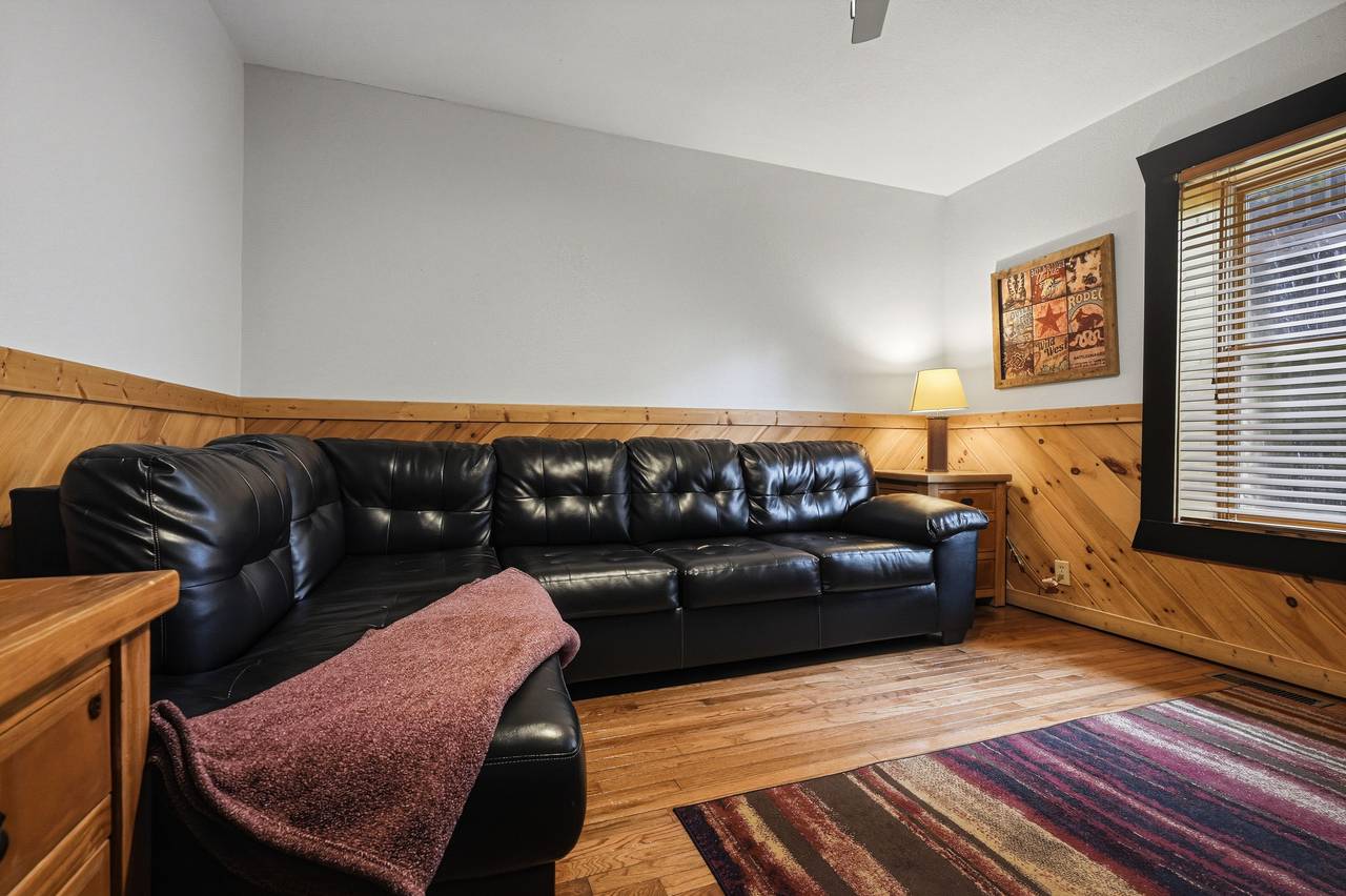 Theater room with oversized TV and comfy couch seating Theater room with oversized TV and comfy couch seating