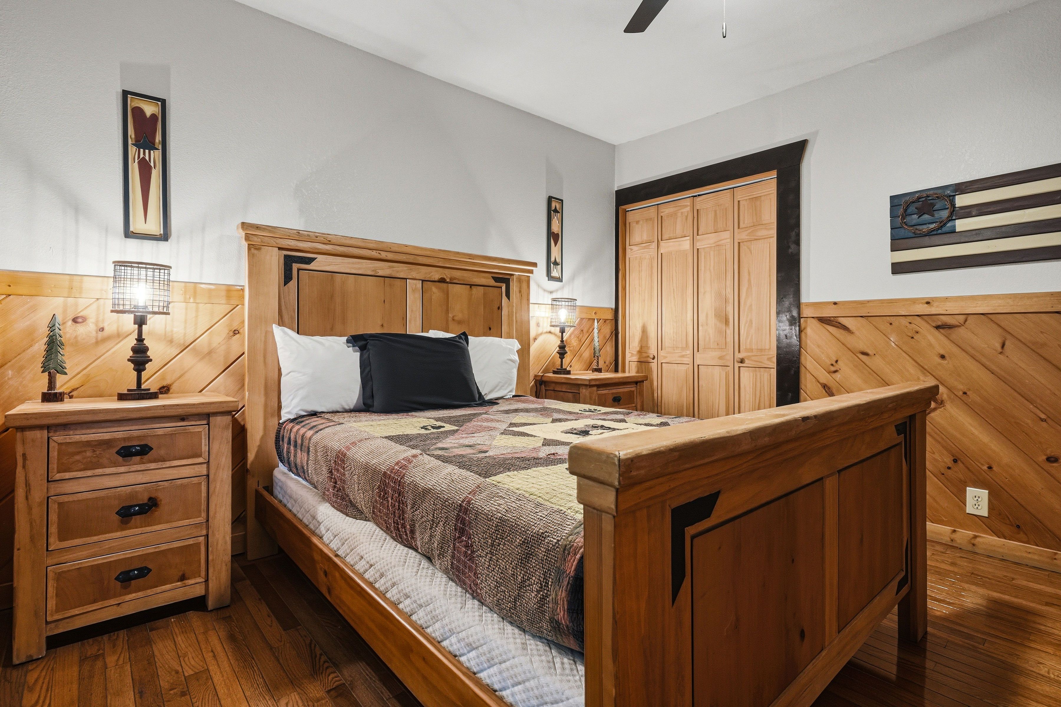 Lower-level queen bedroom with TV and ensuite bath access