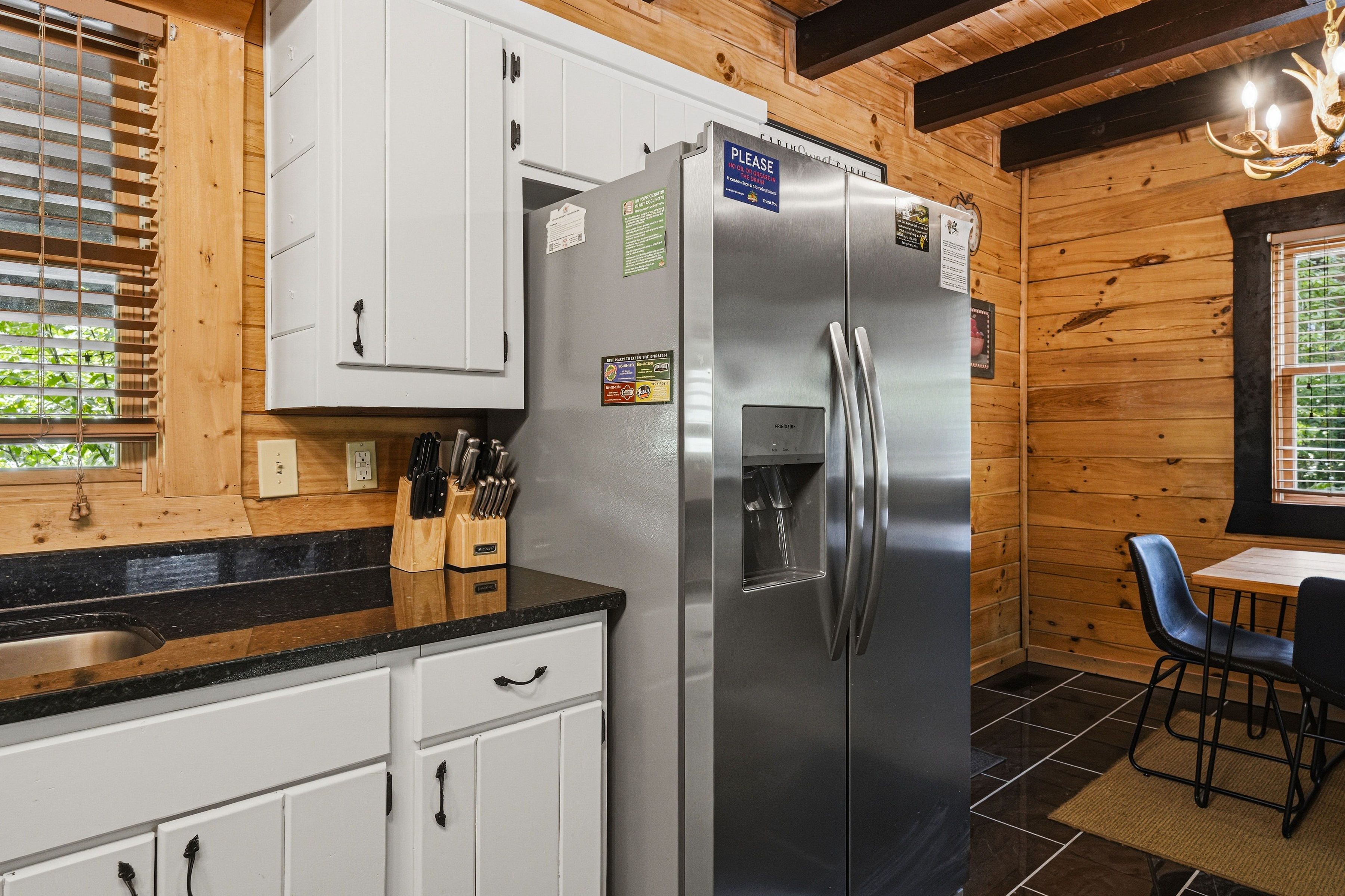 Open kitchen with granite counters and stainless appliances