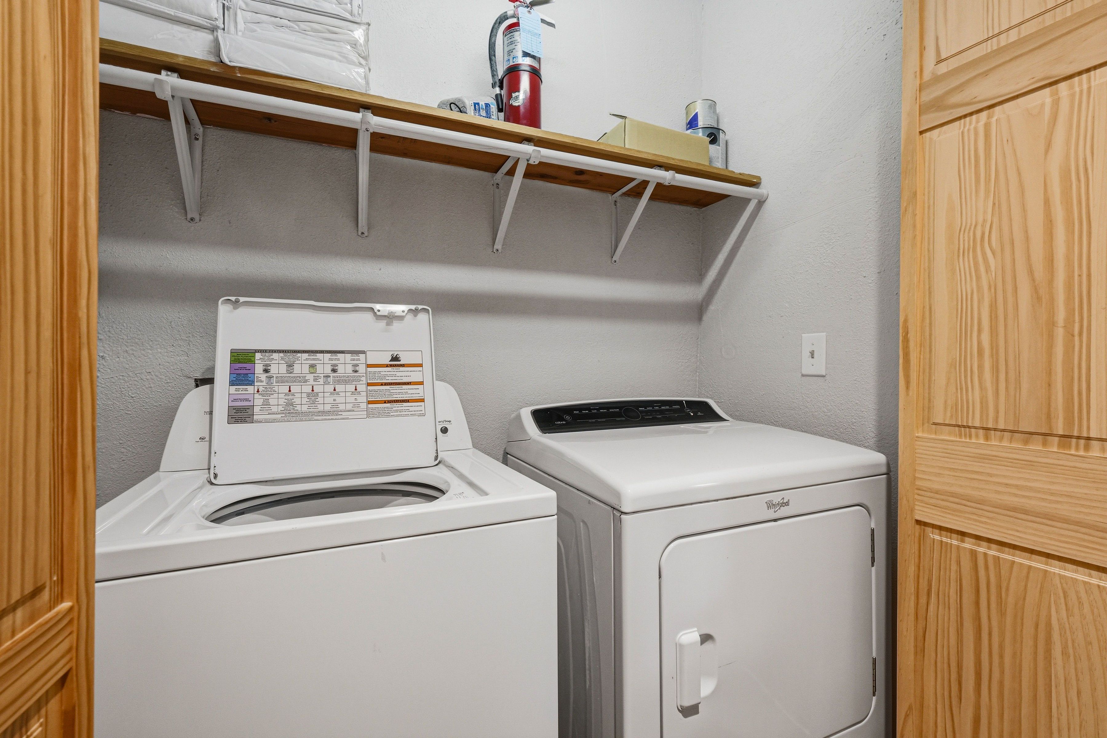 Side-by-side washer and dryer for guest convenience