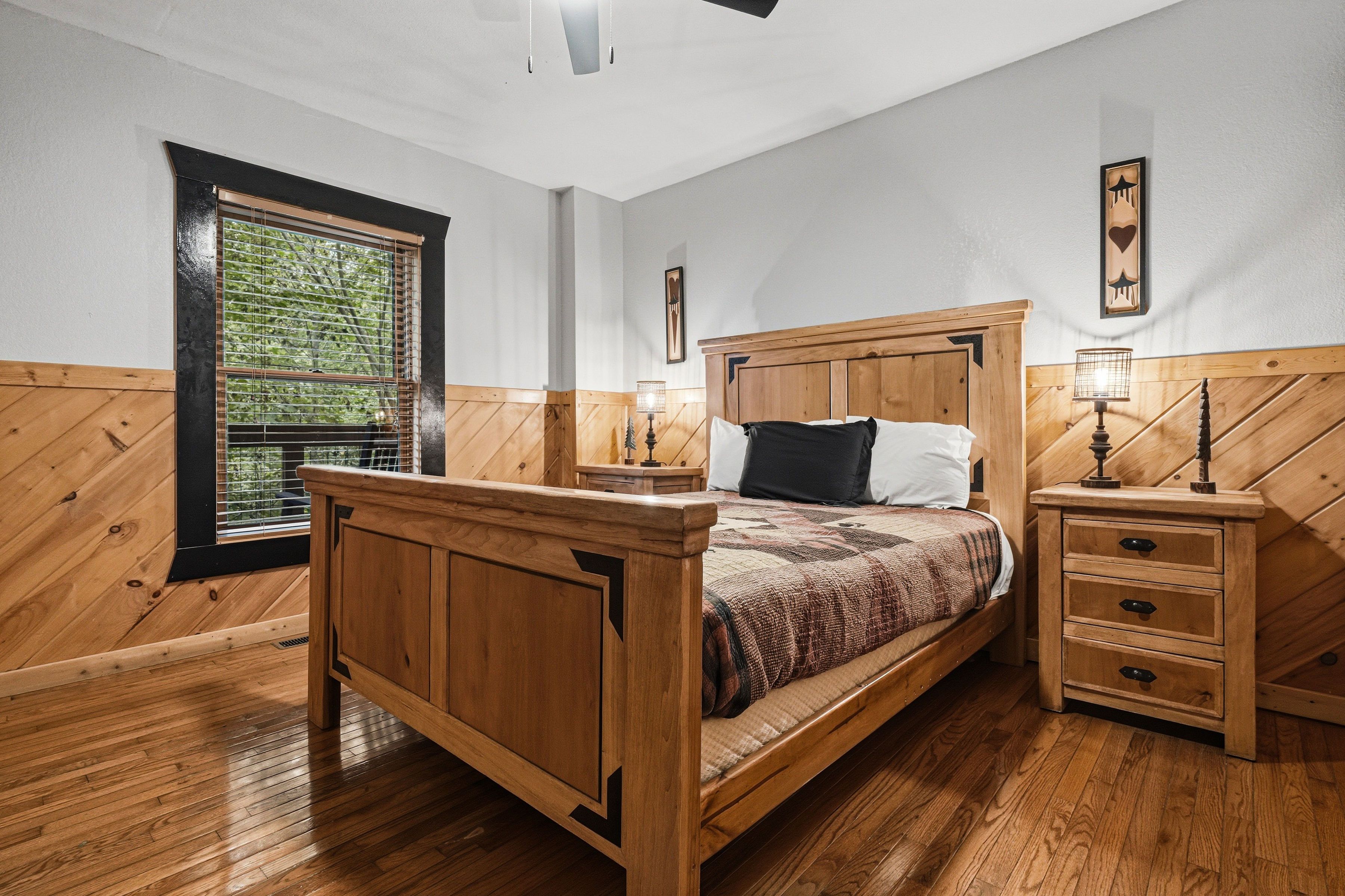 Lower-level queen bedroom with TV and ensuite bath access