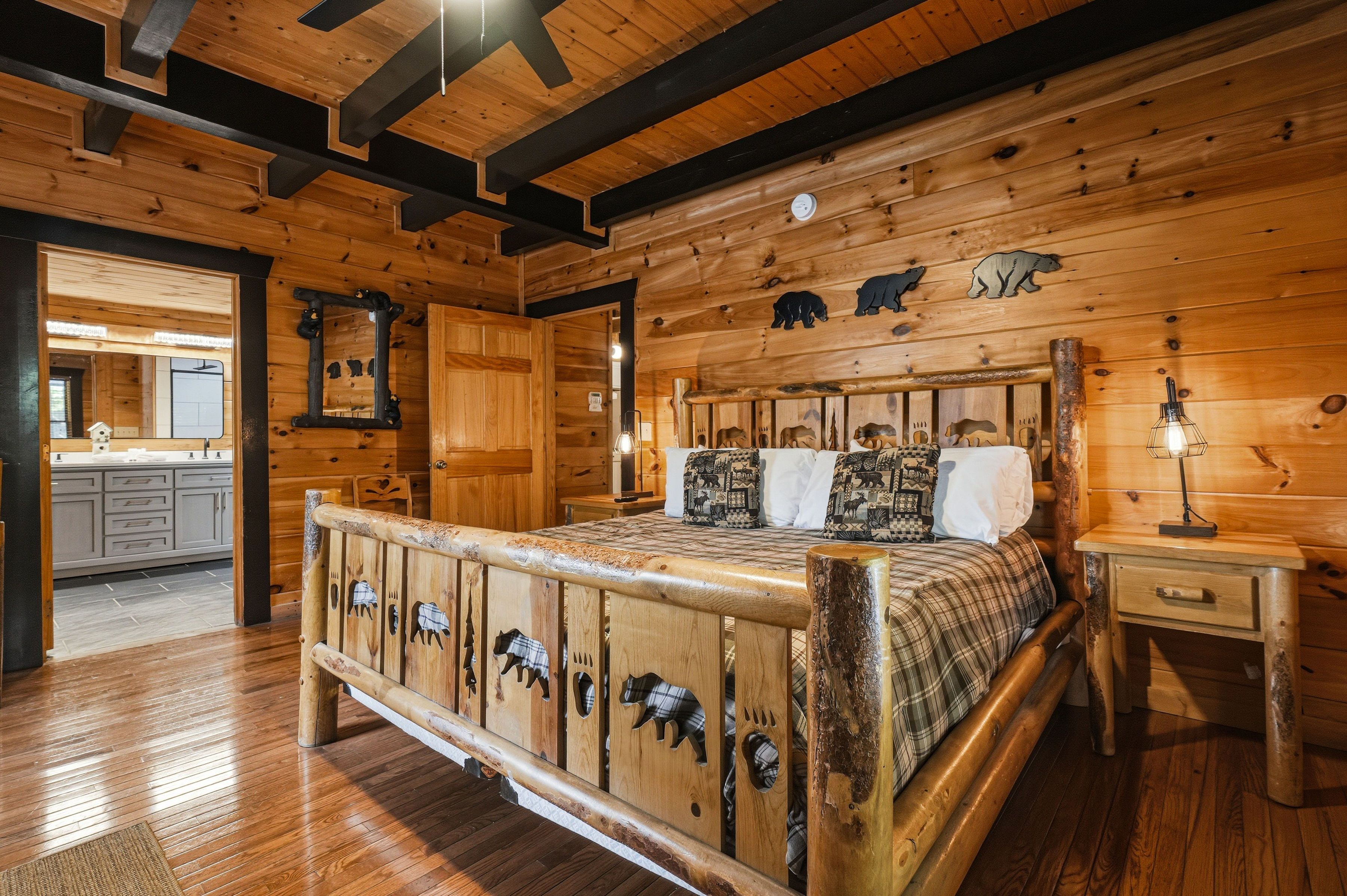 Entry-level king bedroom with TV and private ensuite bath