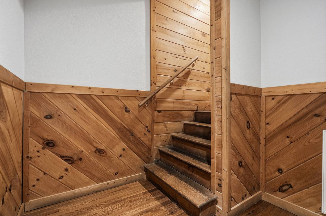 Lower level staircase leading to entry level Lower level staircase leading to entry level