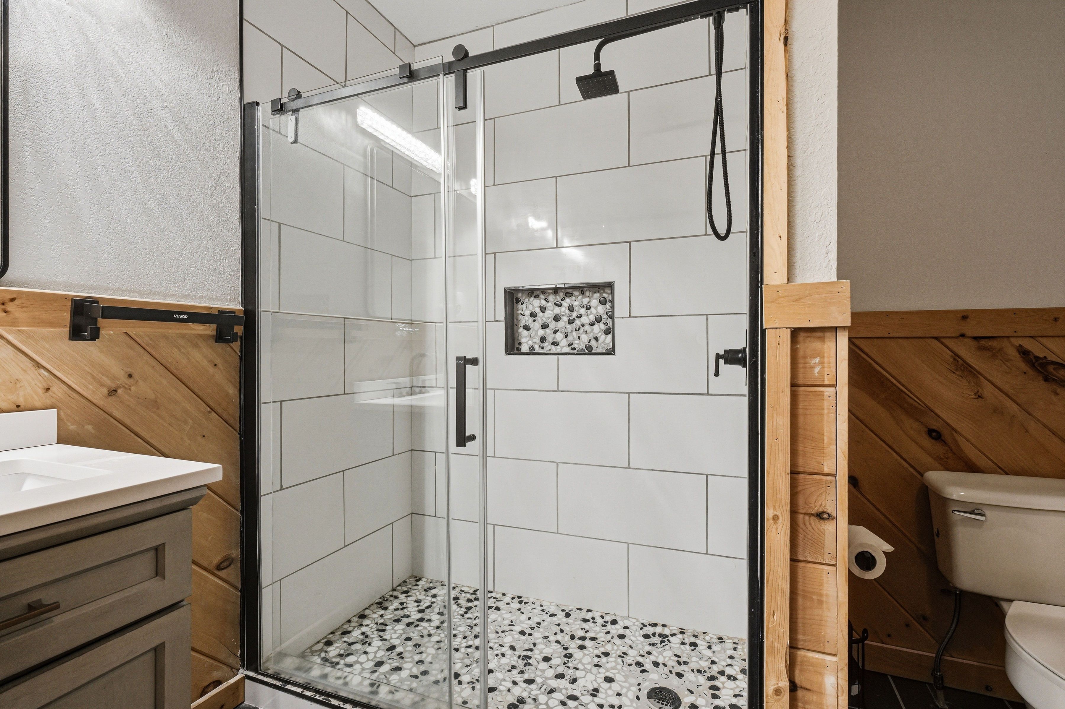 Lower-level shared bath with walk-in shower