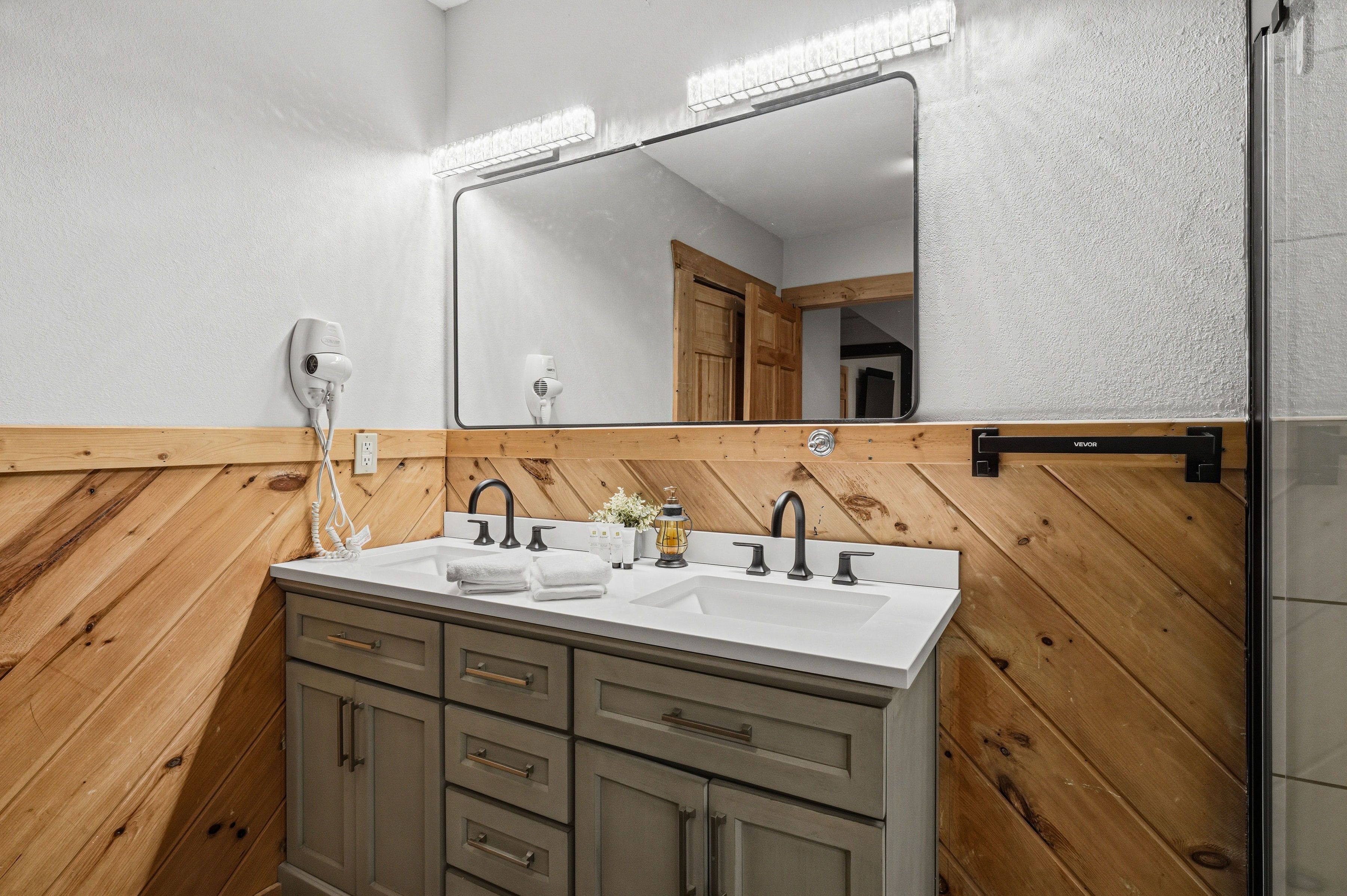 Lower-level shared bath with walk-in shower