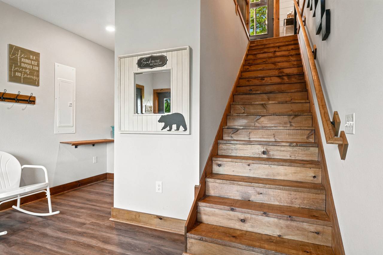 <span class="name">Lower level staircase leading to entry level floor</span> <span class="name">Lower level staircase leading to entry level floor</span>