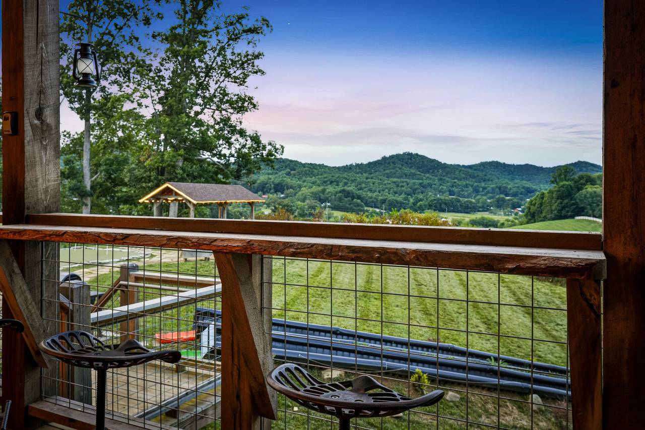 <span class="name">Wraparound porch with peaceful mountain surroundings</span> <span class="name">Wraparound porch with peaceful mountain surroundings</span>