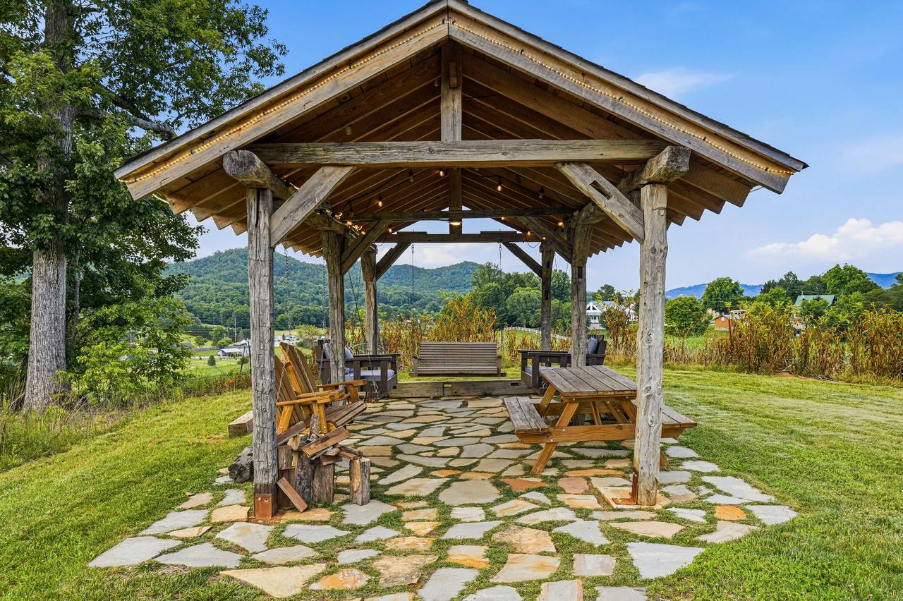 <span class="name">Pavilion with hanging bed swings & picnic seating</span> <span class="name">Pavilion with hanging bed swings & picnic seating</span>