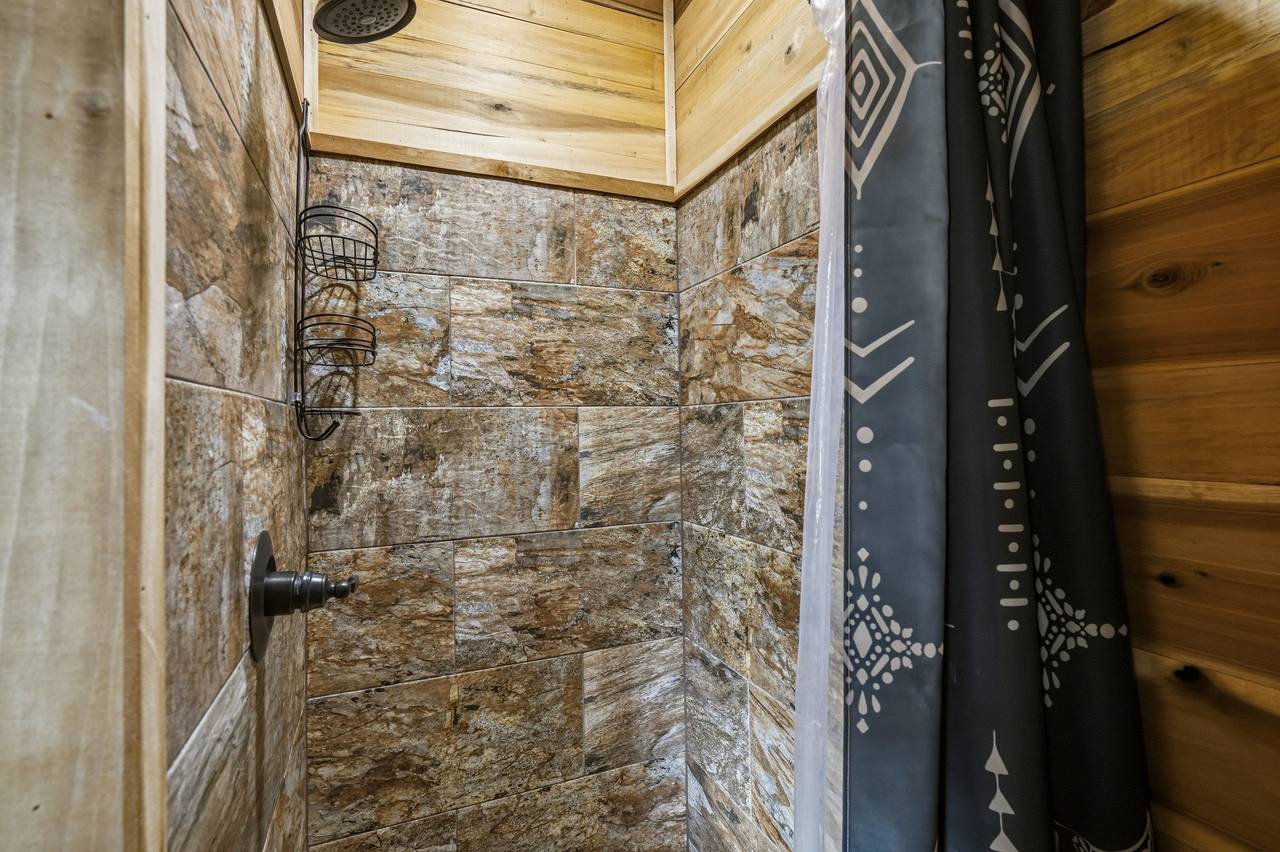 <span class="name">Main level ensuite bathroom with shower & vanity</span> <span class="name">Main level ensuite bathroom with shower & vanity</span>