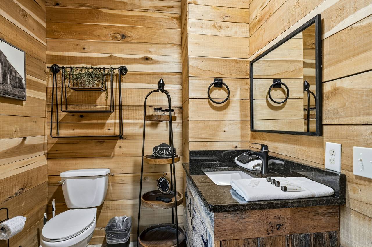 <span class="name">Main level ensuite bathroom with shower & vanity</span> <span class="name">Main level ensuite bathroom with shower & vanity</span>
