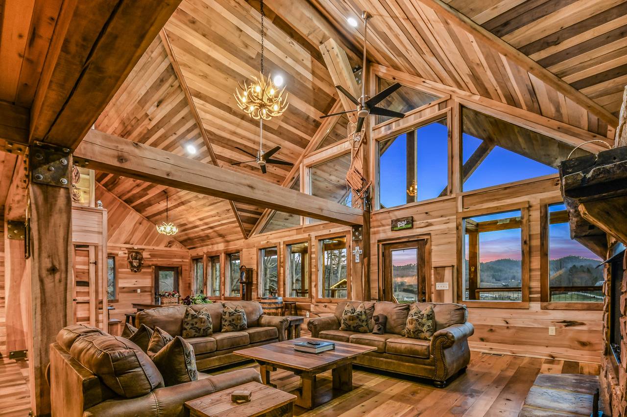 <span class="name">Open living room with soaring ceilings & mountain charm</span> <span class="name">Open living room with soaring ceilings & mountain charm</span>