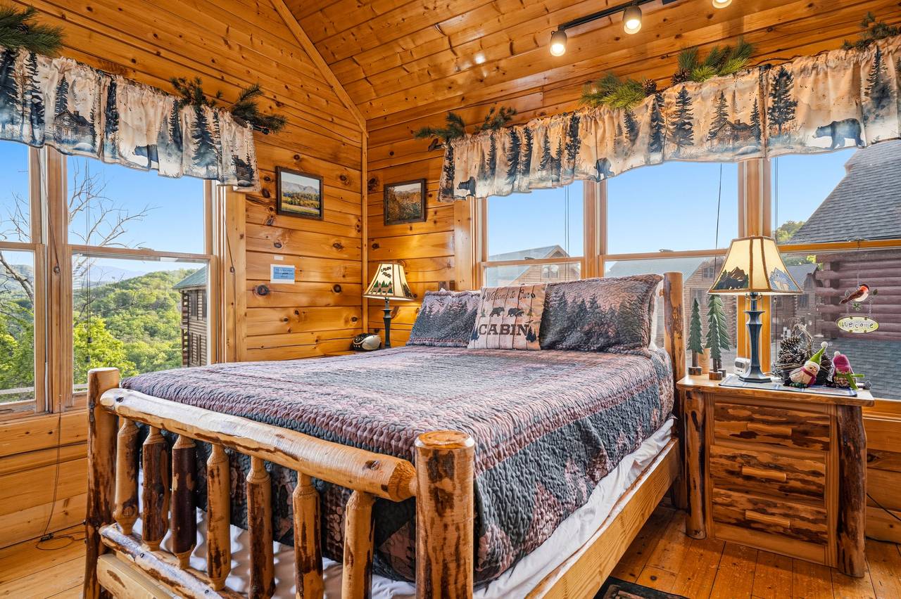 <span class="name">Loft bedroom with handcrafted queen log bed</span> <span class="name">Loft bedroom with handcrafted queen log bed</span>