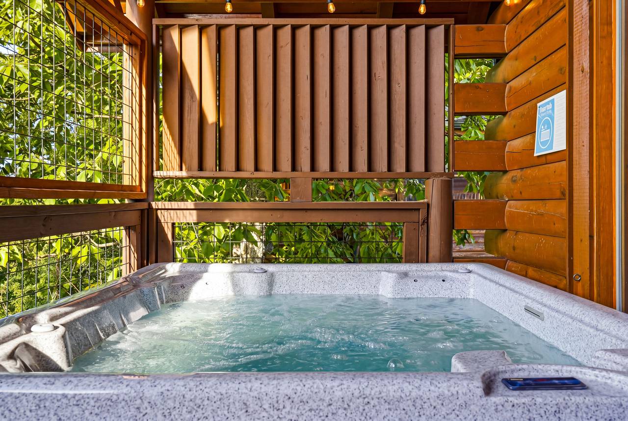 <span class="name">Six-person hot tub with peaceful mountain setting</span> <span class="name">Six-person hot tub with peaceful mountain setting</span>