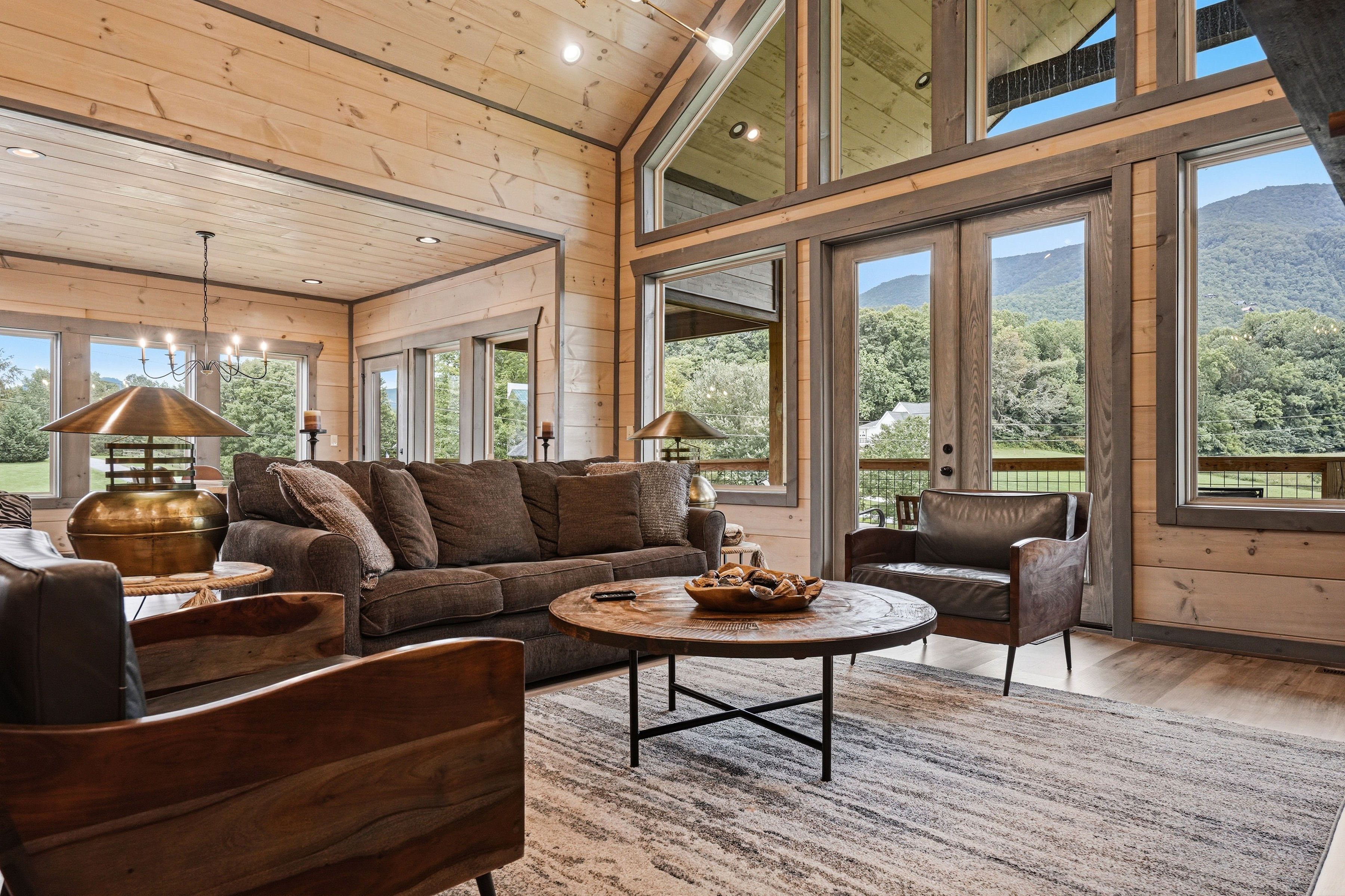 <span class="name">Open living room connects to kitchen and dining areas</span>