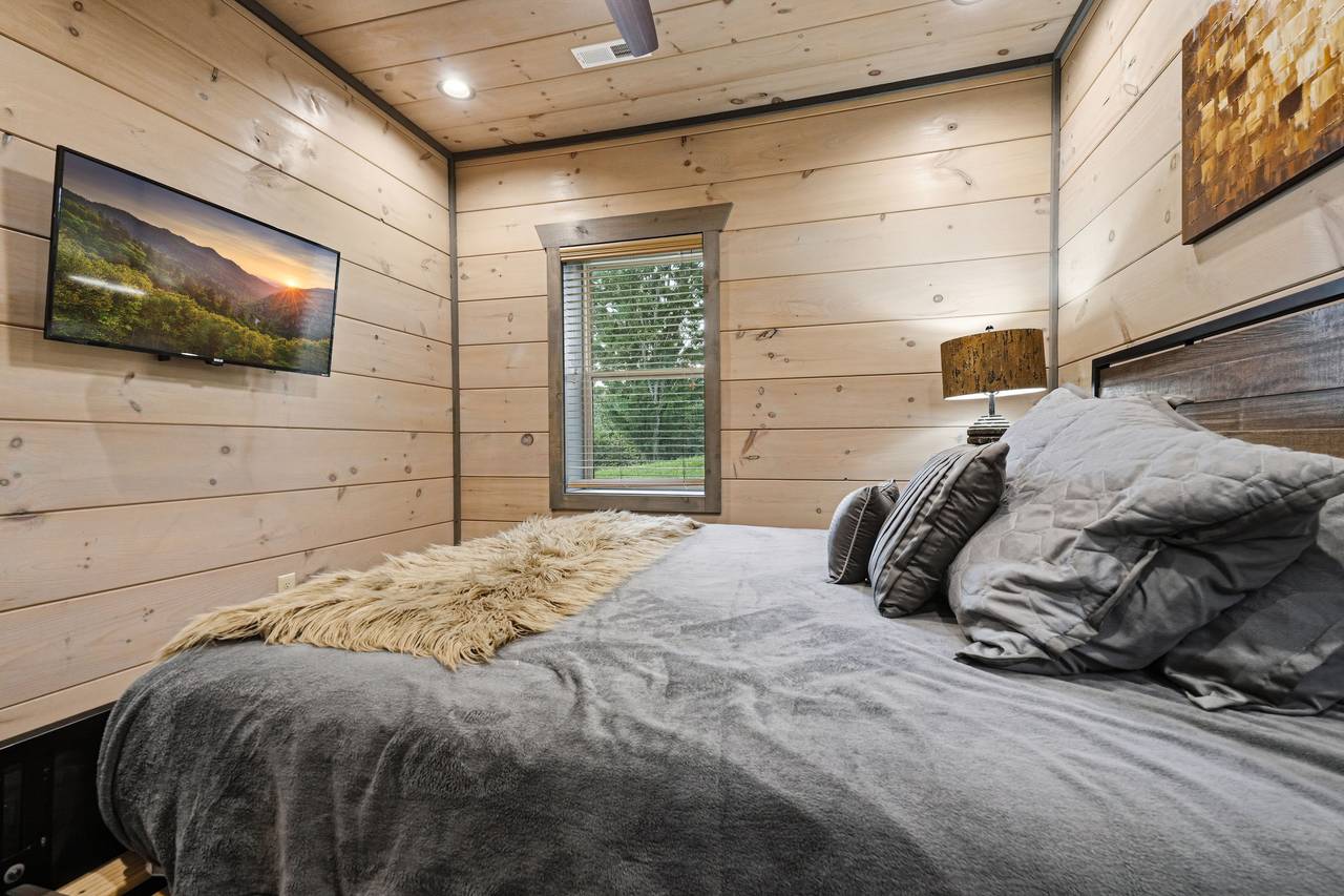 <span class="name">Lower-level king bedroom with ensuite and shared bath</span> <span class="name">Lower-level king bedroom with ensuite and shared bath</span>