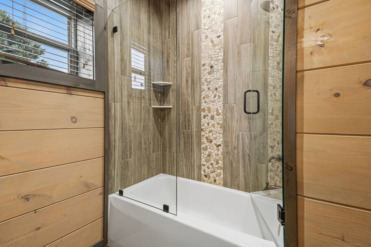 <span class="name">Ensuite bath also serves the game room and living area</span> <span class="name">Ensuite bath also serves the game room and living area</span>