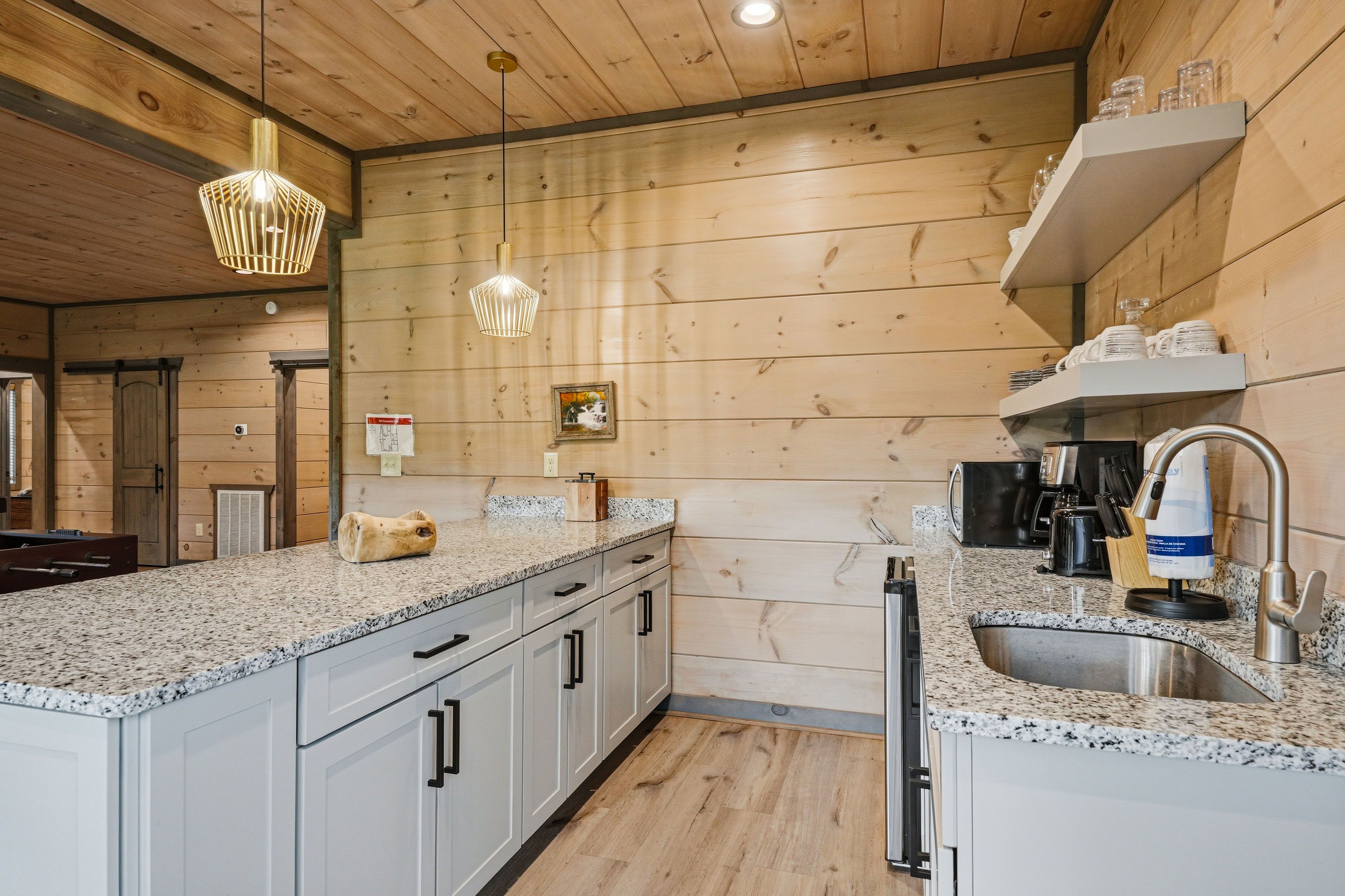 <span class="name">Kitchenette includes a mini refrigerator, microwave, & coffee ma</span>
