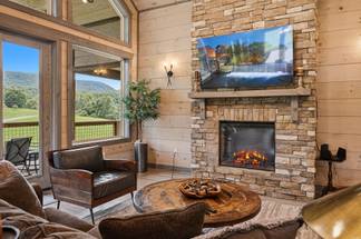 <span class="name">Living room fireplace creates a cozy mountain setting</span> <span class="name">Living room fireplace creates a cozy mountain setting</span>