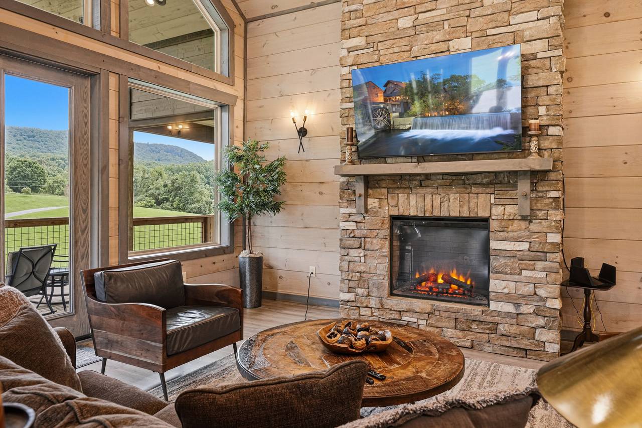<span class="name">Living room fireplace creates a cozy mountain setting</span> <span class="name">Living room fireplace creates a cozy mountain setting</span>