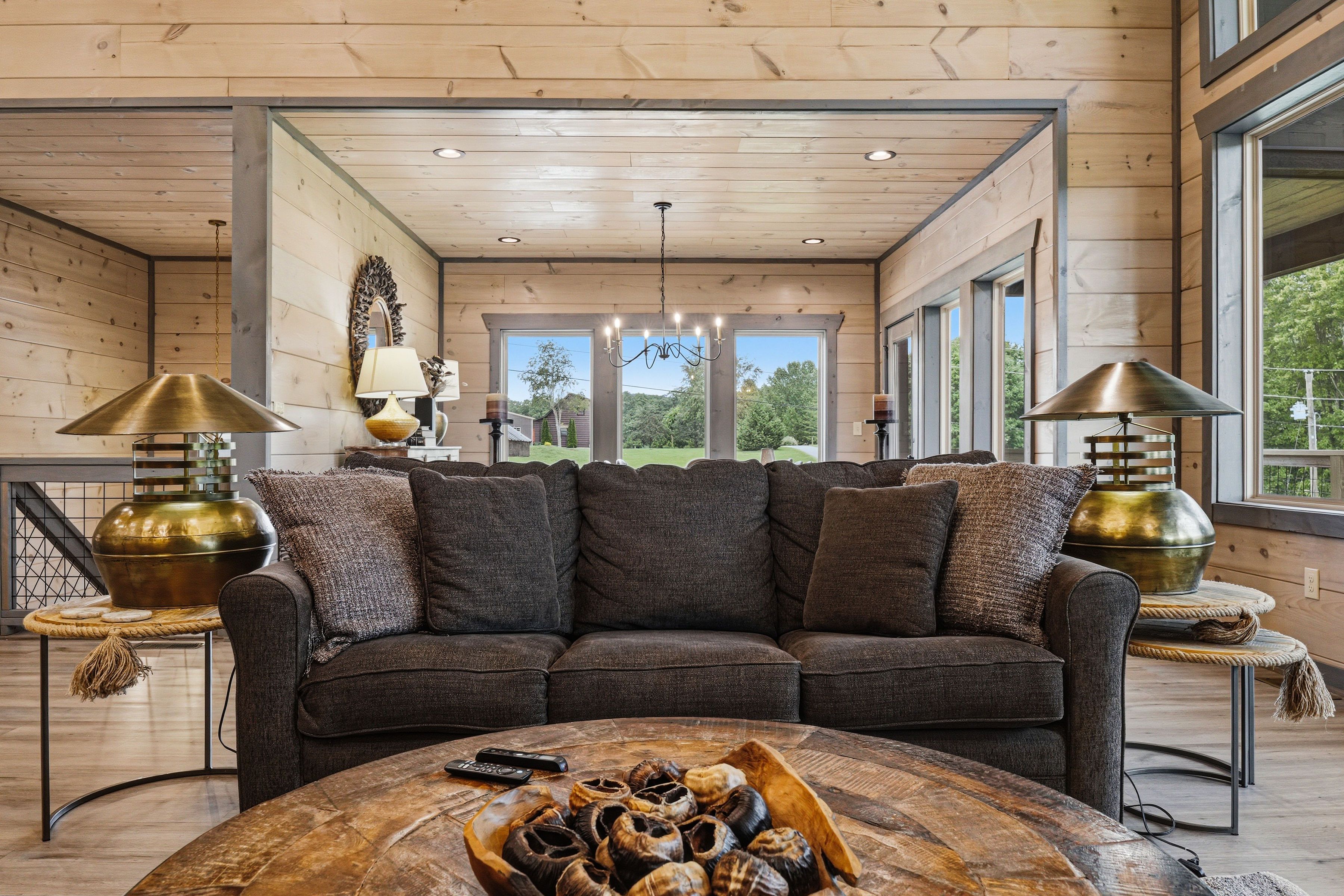 <span class="name">Upper-level living room with comfortable group seating</span>