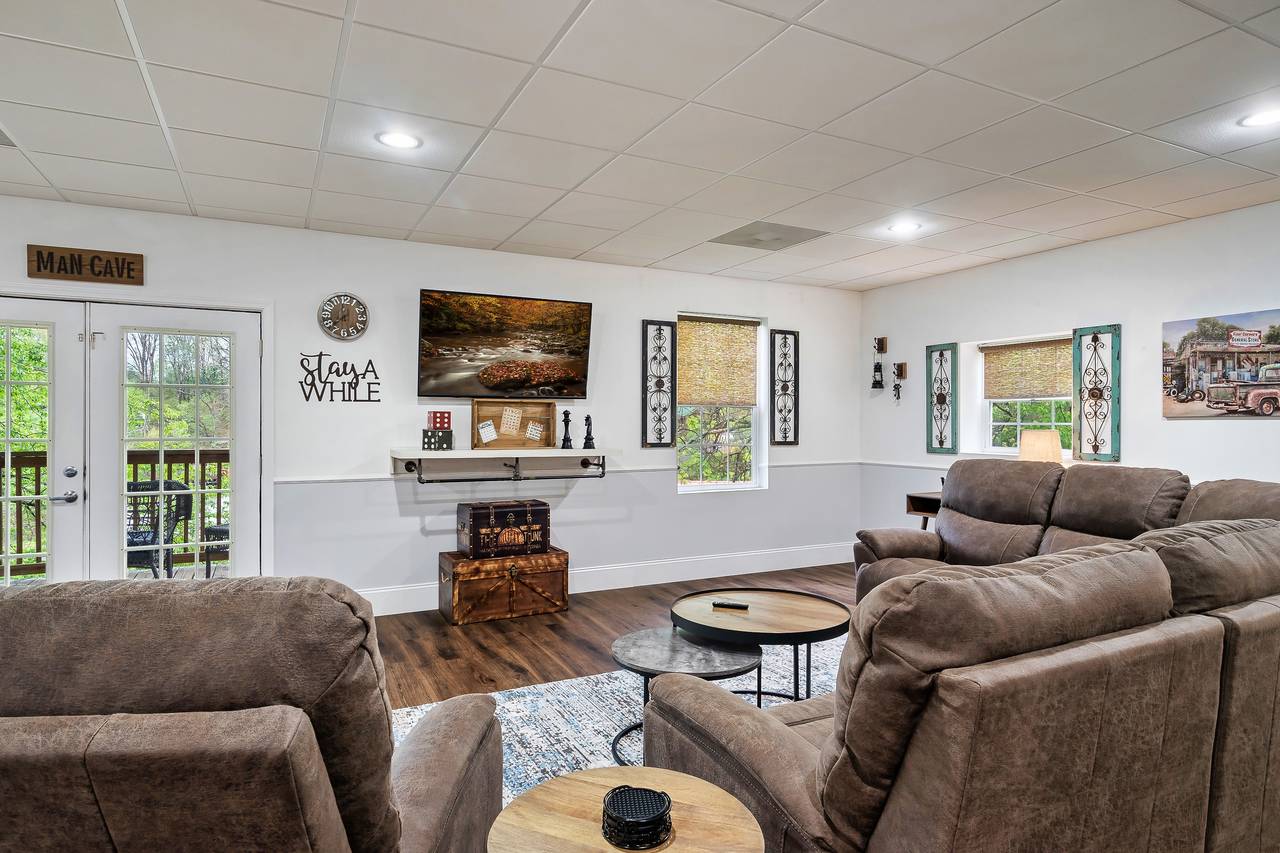 Large TV and comfortable seating in game room Large TV and comfortable seating in game room