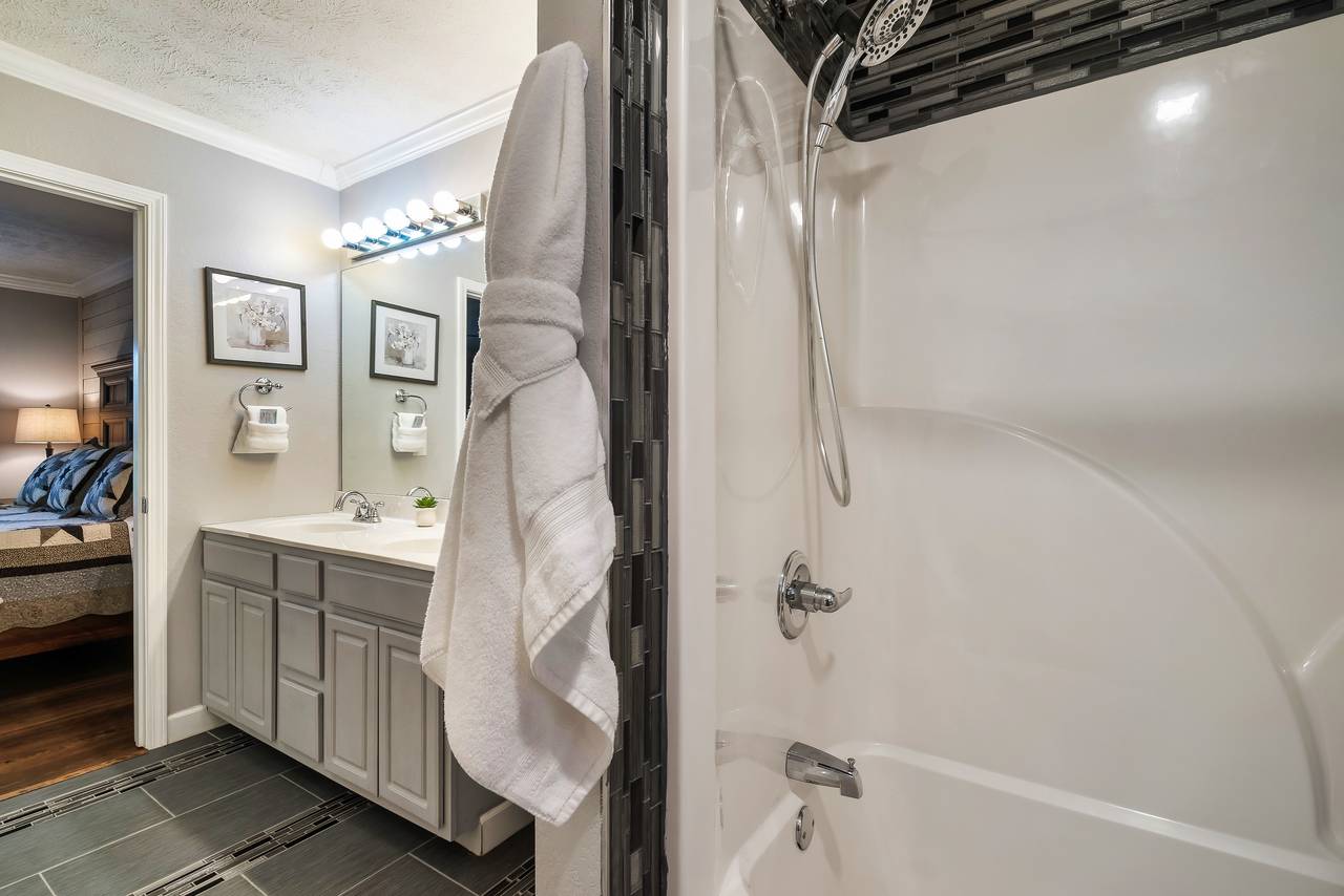 Ensuite bathroom attached to king bedroom with tub/shower combo Ensuite bathroom attached to king bedroom with tub/shower combo