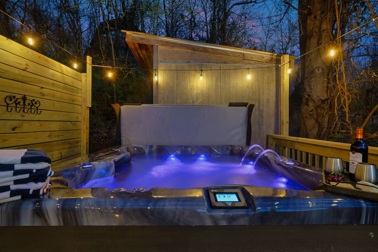 Private hot tub tucked away for added relaxation Private hot tub tucked away for added relaxation
