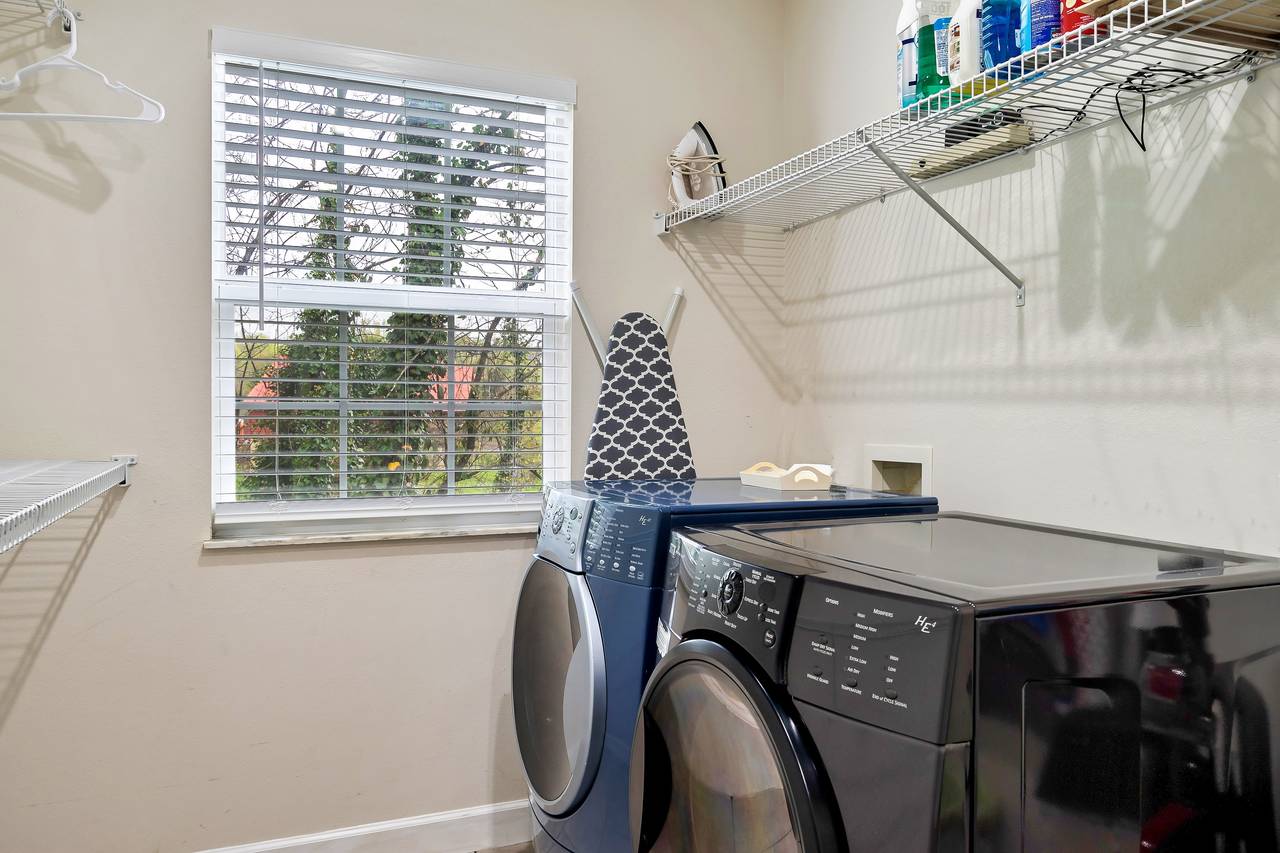 Convenient laundry room with full-size appliances Convenient laundry room with full-size appliances