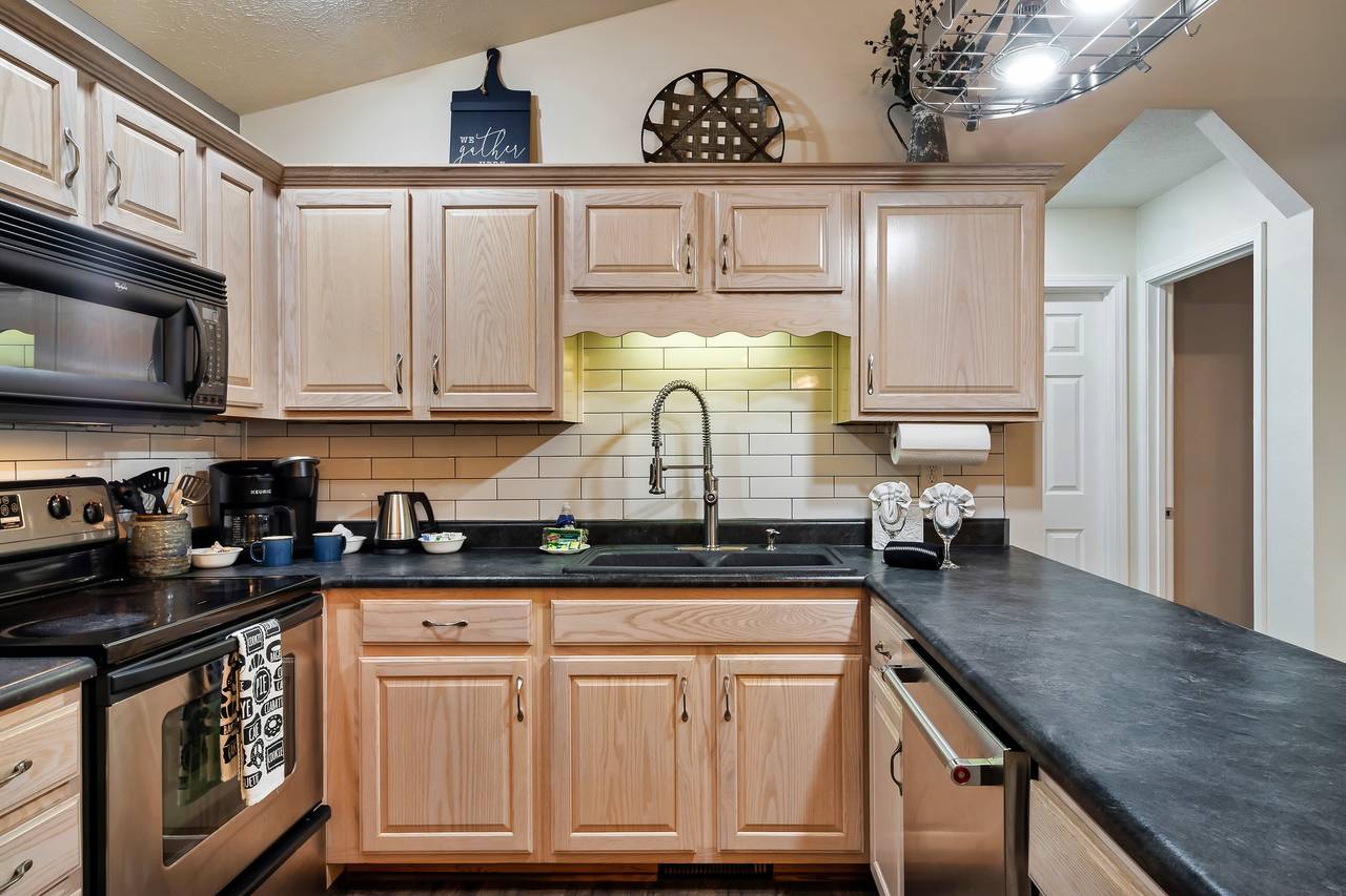 Kitchen fully-equipped for meals, snacks, and family gatherings Kitchen fully-equipped for meals, snacks, and family gatherings