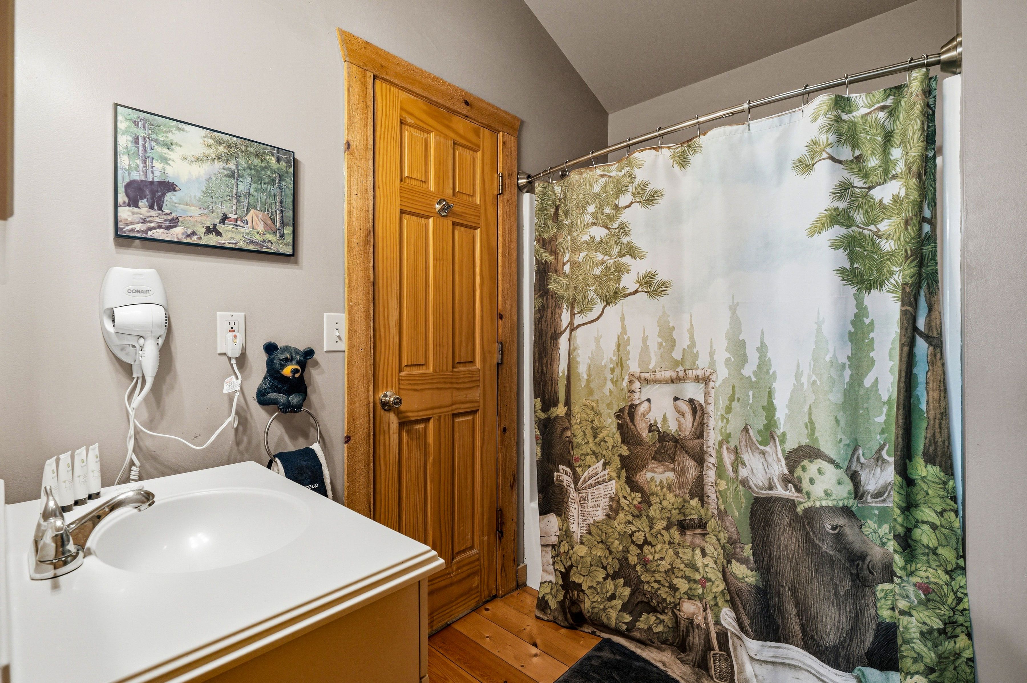 <span class="name">Upper full bathroom with a tub and shower combination</span>