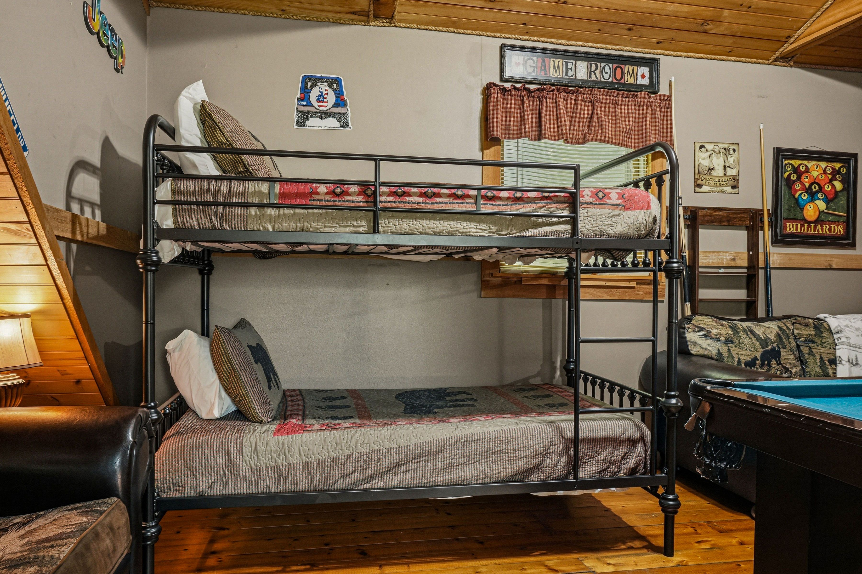 <span class="name">Upper loft with a twin-over-twin bunk bed</span>
