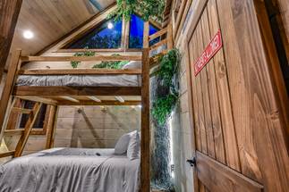 <span class="name">Upper-level twin bunk room with TV and custom treehouse</span> <span class="name">Upper-level twin bunk room with TV and custom treehouse</span>