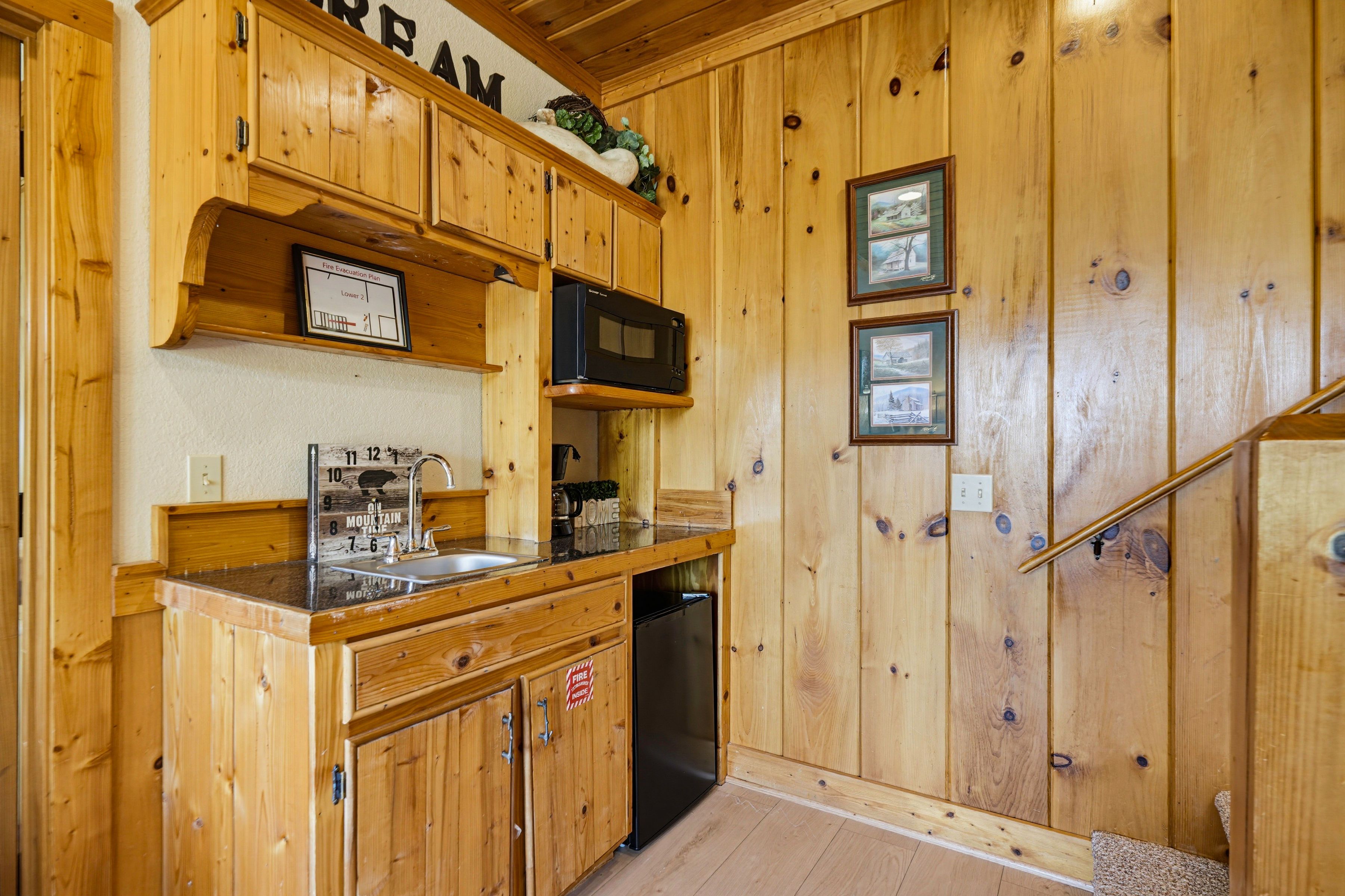 <span class="name">Kitchenette includes a sink, microwave, and mini refrigerator</span>