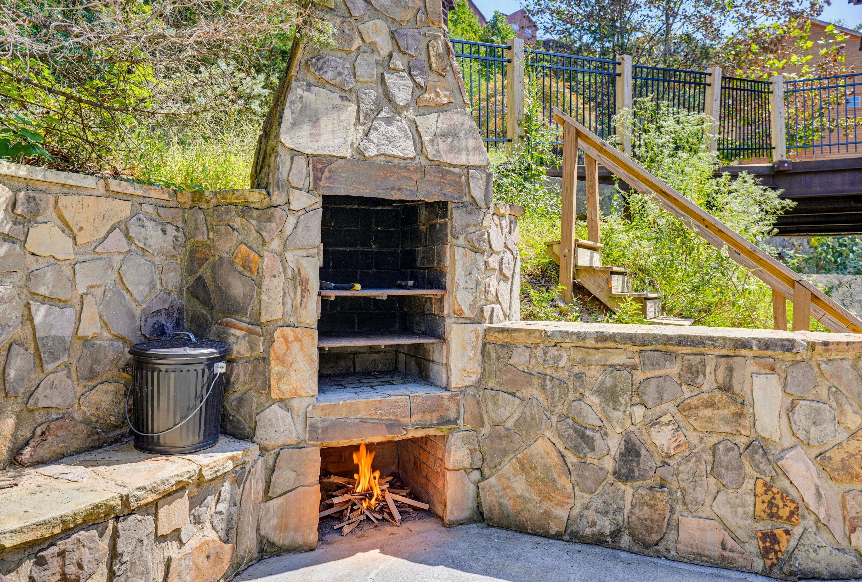 <span class="name">Gather around the natural wood-burning fire pit | Charcoal Grill</span>