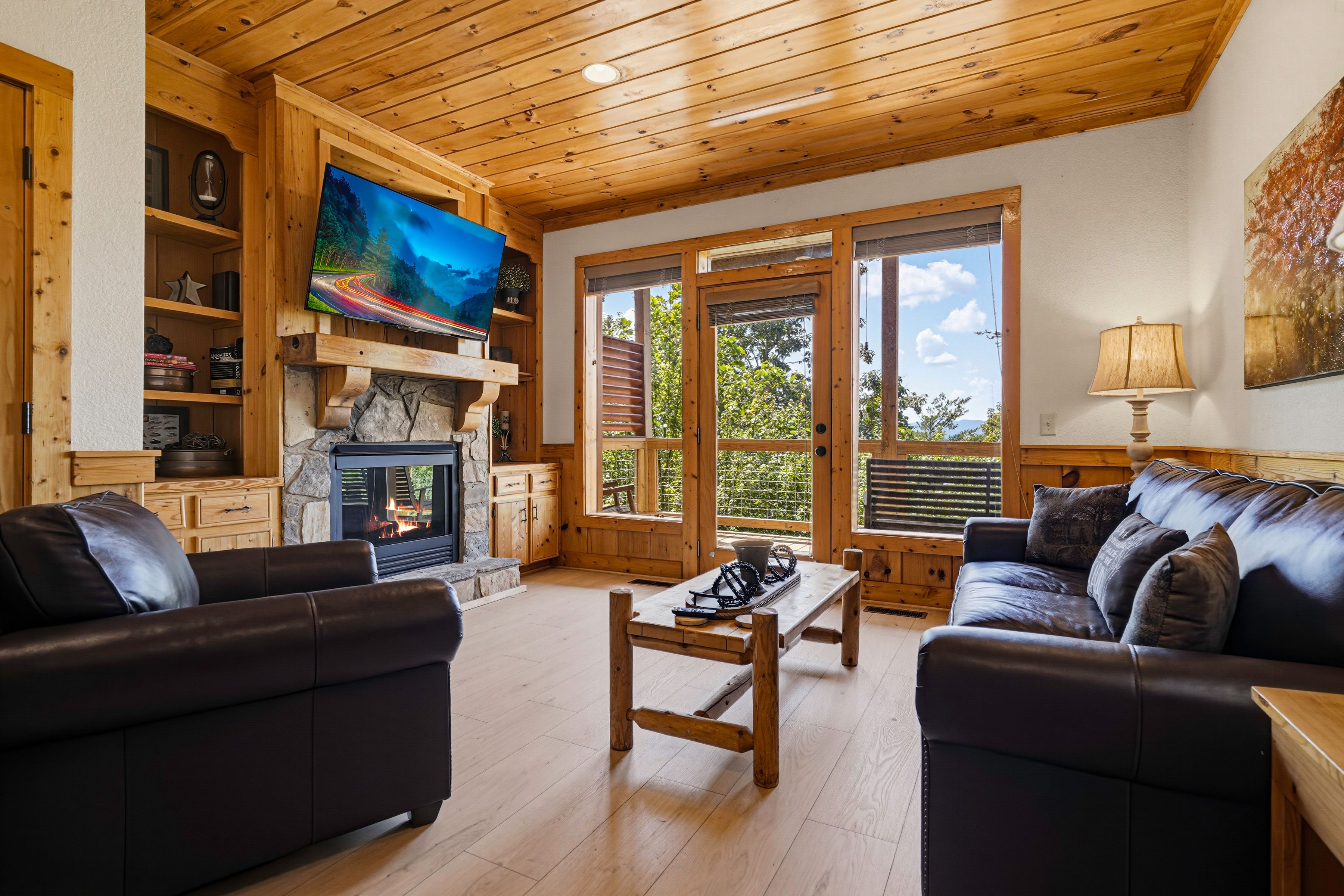 <span class="name">Lower-level den features a TV and cozy gas fireplace</span>