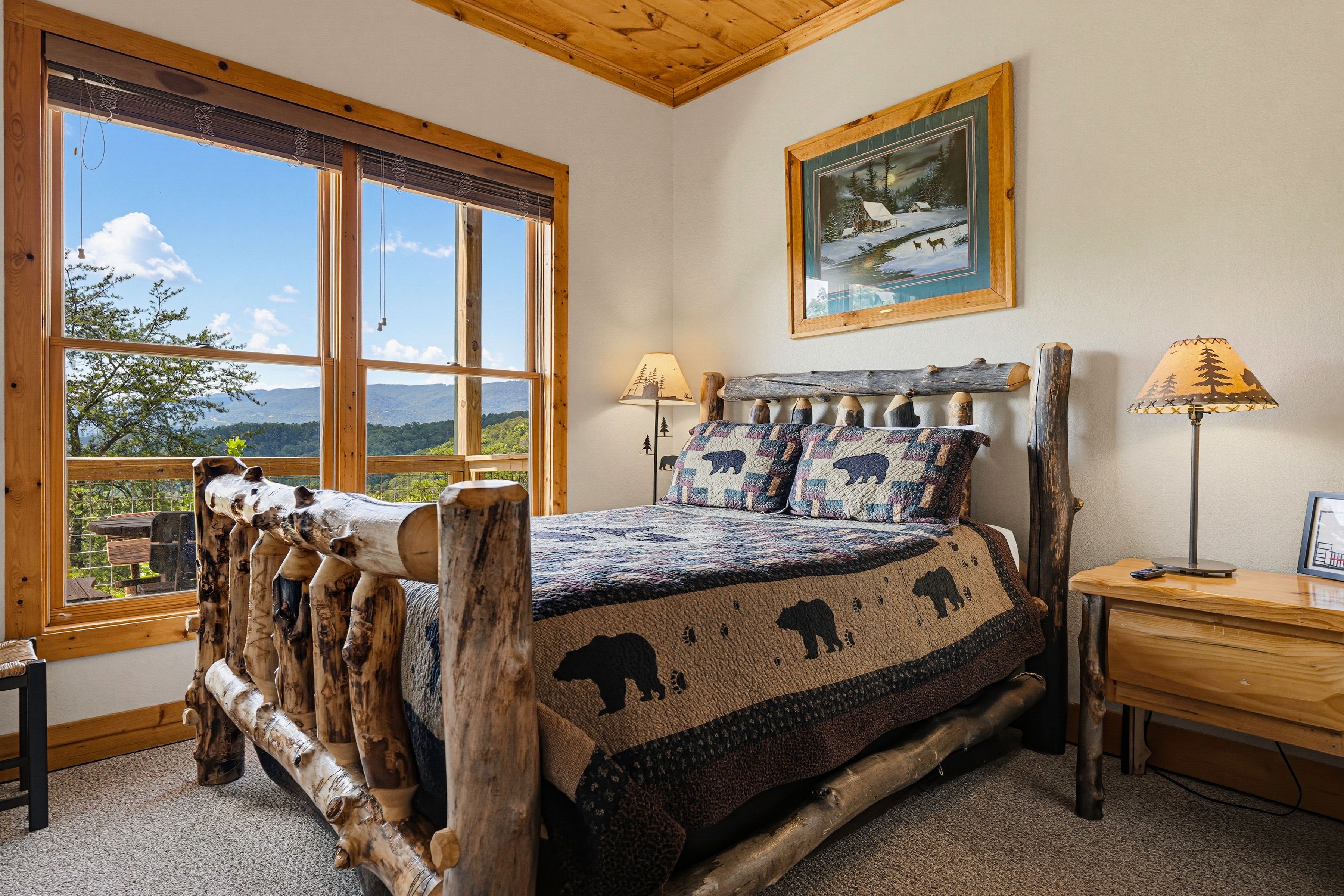 <span class="name">First lower-level bedroom with a comfortable queen bed</span>
