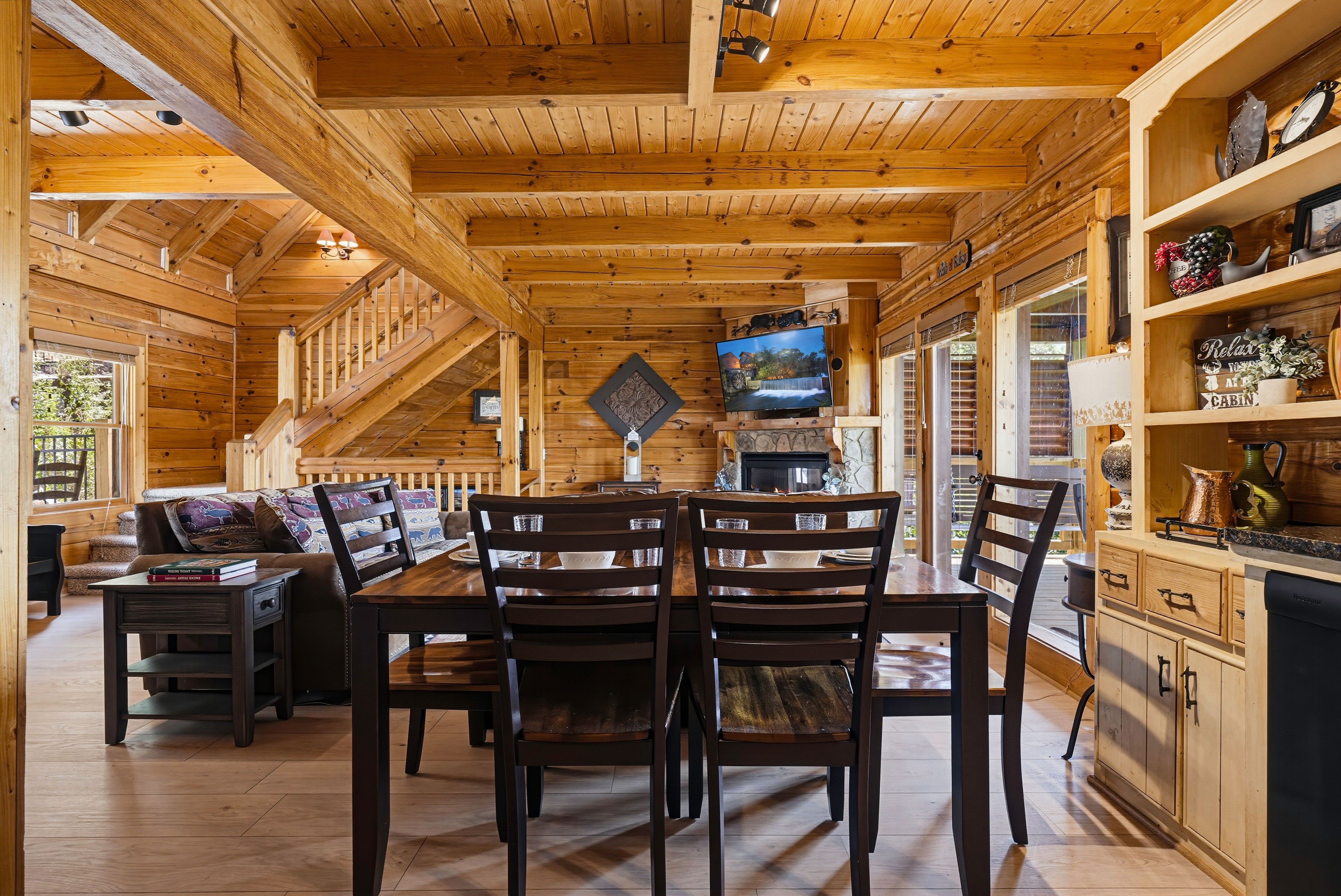 <span class="name">Indoor dining area offers a table and chairs for shared meals</span>